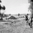 Весна 1942-го, Крымский фронт. Фронтовой фотокоррес­пондент Анатолий Гаранин нажал на спуск фотокамеры в момент, когда перед нашими атакующими солдатами разорвался фашистский снаряд. Фото из архива редакции. - Крымская правда