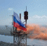 Над самой высокой точкой Херсона торжественно поднят флаг России - Вести Крым