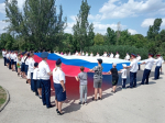 В День России сотрудники Следственного комитета развернули тридцатиметровый флаг страны в Симферополе (ФОТО, ВИДЕО)