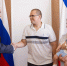 Сергей Аксёнов вручил молодой семье Орловых важный документ. Фото с сайта glava.rk.gov.ru - Крымская правда